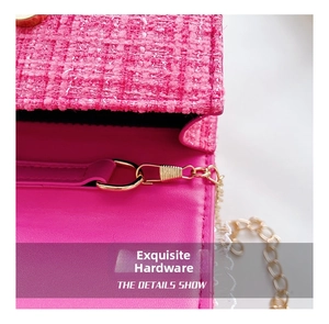 Macro detail of the rose pink tweed fabric and gold metal clasp on a child's handbag