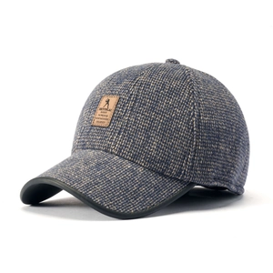 Winter tweed baseball cap for men featuring leather brim and warm textured knit fabric