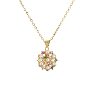 Elegant gold necklace with a round pearl pendant and colorful zircon stones