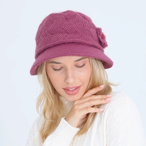 Close-up of purple knitted bucket hat with flower decoration and warm lining