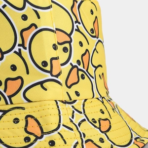 Close-up of yellow duck print detail and twill fabric texture on fisherman hat