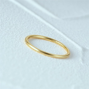 Detailed macro view of S925 hallmark on minimalist 18K gold plated thin zircon ring
