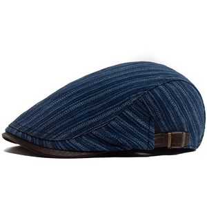 Classic blue striped ivy cap with brown leather brim and adjustable metal buckle side