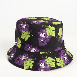 Close-up of black cotton bucket hat featuring purple cartoon grape prints and stitched brim