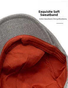 Détail de la casquette en lin gris avec bandeau intérieur en coton orange doux