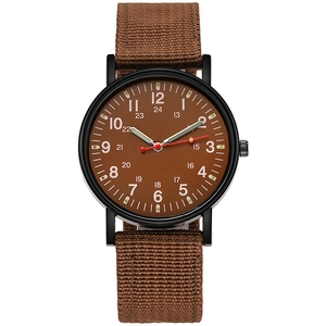 Detail of military style watch with brown nylon strap and 24-hour scale dial