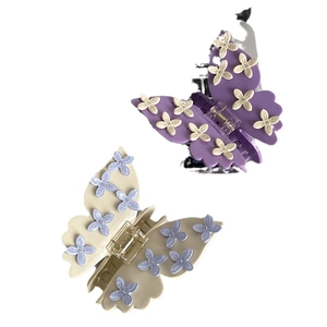 Elegant butterfly hair claws with delicate flower accents in purple and beige styles