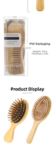 Detail of eco-friendly bamboo hairbrush set in a clear PVC box with dimensions 24x9x5cm