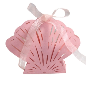 Pink laser-cut shell shaped candy gift box with a delicate matching silk ribbon bow