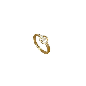 Adjustable gold T-shaped open ring with cubic zirconia accents in a minimalist style