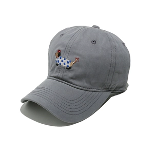 Detailed view of embroidery on gray cotton baseball cap featuring a dachshund dog