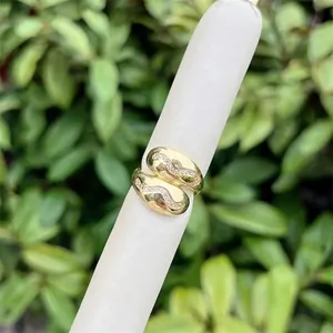 Adjustable 18K gold plated open ring with wavy pave cubic zirconia stones in minimalist style