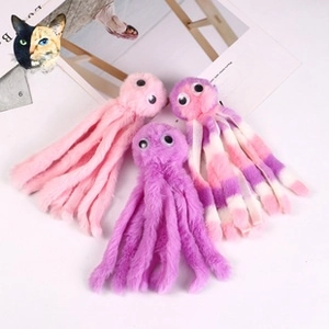 Macro detail of plush octopus dolls in pink and purple colors with long soft tentacles
