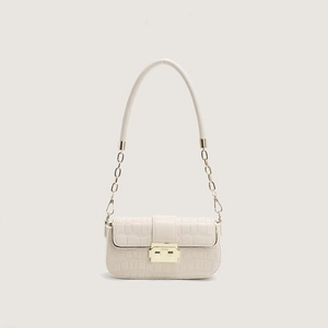 Minimalist beige crocodile pattern crossbody bag with golden chain strap and flap closure
