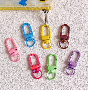 Close-up of colorful metal lobster clasps in candy colors for DIY jewelry making