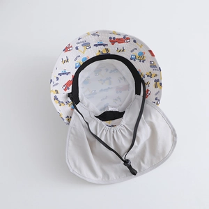 Detail of grey sun hat showing vehicle patterns, neck flap, and mesh lining texture