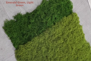 Macro texture of emerald and light green artificial silk moss for landscape layouts