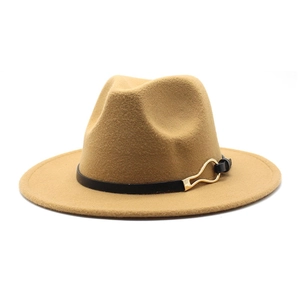 Detail of camel wool fedora hat featuring black leather band and gold metal buckle