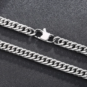 Silver cuban link chain necklace in stainless steel with lobster clasp on black background