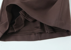 Detail view of coffee brown mini skort with built-in safety lining and neat double stitching