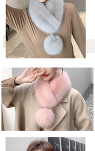 Detail of light gray and pink faux fox fur scarves with decorative plush pom-poms