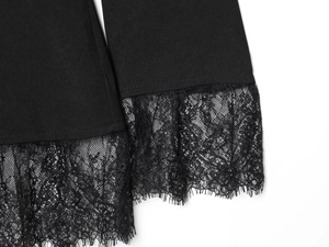 Detail of elegant black blazer featuring floral lace hem and twill fabric texture