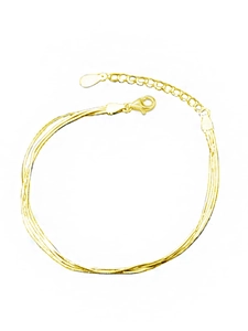 Close-up of golden multi-strand snake chain bracelet with extender and lobster clasp
