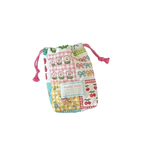 Quilted drawstring camera storage bag featuring colorful floral patchwork and cherry prints