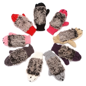 Detailed view of various colorful knitted hedgehog-style gloves in circular arrangement