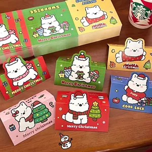 Set of cute cartoon dog Christmas header cards in various colors on a wooden background