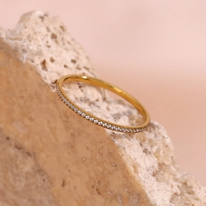 Minimalist 18K gold plated stainless steel ring with micro-set zircon on a stone