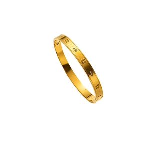 Polished gold titanium steel four-leaf clover bangle featuring pavé stones and engraving