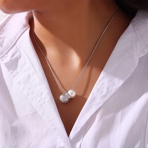 Minimalist peanut shaped pendant necklace with white pearl on silver chain for women