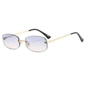 Fashion rimless sunglasses with blue-brown gradient lenses and gold metal temples