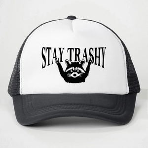 Black and white Stay Trashy trucker hat featuring a funny raccoon graphic and mesh back