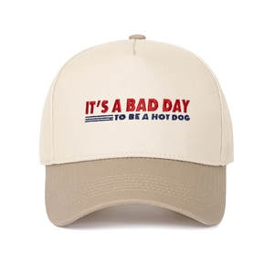 Close-up of retro embroidery on two-tone cotton baseball cap with curved brim detail
