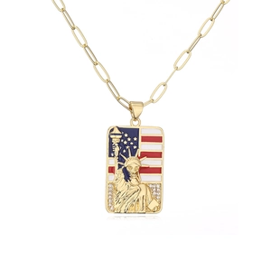 Detailed close-up of Statue of Liberty pendant with enamel flag and zircon accents