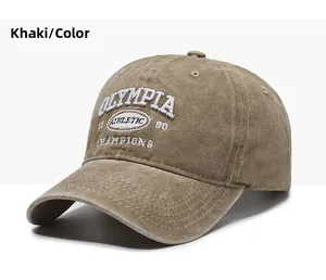 Close-up of vintage khaki washed cotton baseball cap with white 3D athletic embroidery