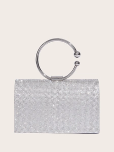 Elegant silver evening clutch bag with sparkling rhinestones and a metal round handle