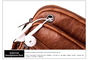 Macro detail of brown leather bag showing external headphone jack and metal zipper head