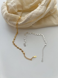 Detail of S925 sterling silver star chain bracelet with metal purity hallmark and linen pouch