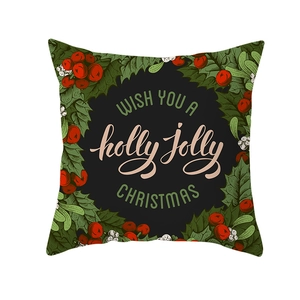 Detail of a Christmas pillowcase featuring holly berries and a holiday wish text