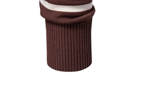 Detailed macro view of the brown ribbed knit cuff with white decorative stripes