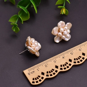 Baroque pearl flower stud earrings with size reference next to a wooden ruler