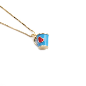 Minimalist gold plated necklace featuring a blue coffee mug pendant with a red heart