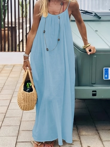 Close-up of a light blue backless maxi dress with a flowy hem for a relaxed summer look