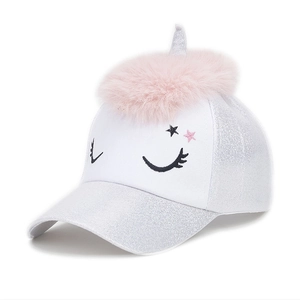 Detail of sequined unicorn baseball cap with pink pom-pom and silver horn for kids