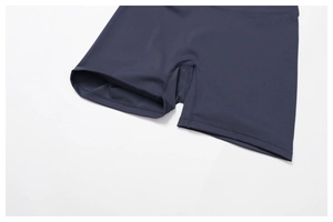 Detail view of navy blue high-waist yoga shorts with professional flatlock stitching