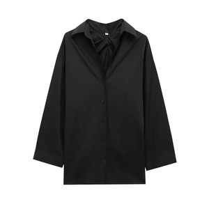 Detail of classic lapel collar on black long sleeve shirt with woven cotton texture