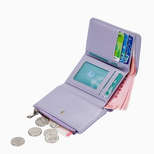 Lavender purple trifold wallet for women featuring multiple card slots and zipper coin pocket